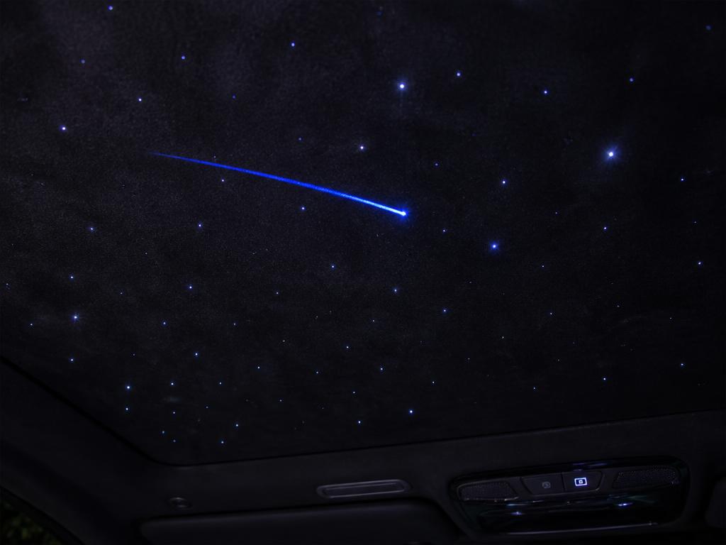 Black suede starlight headliner with a blue shooting star streak